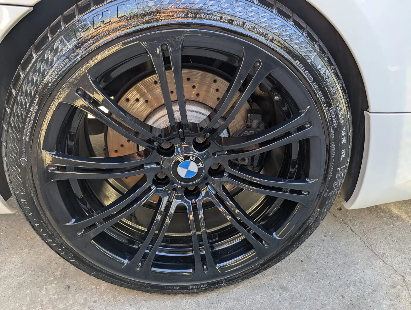 BMW alloy wheel refinished in gloss black at WK Detailing, Stratford-upon-Avon